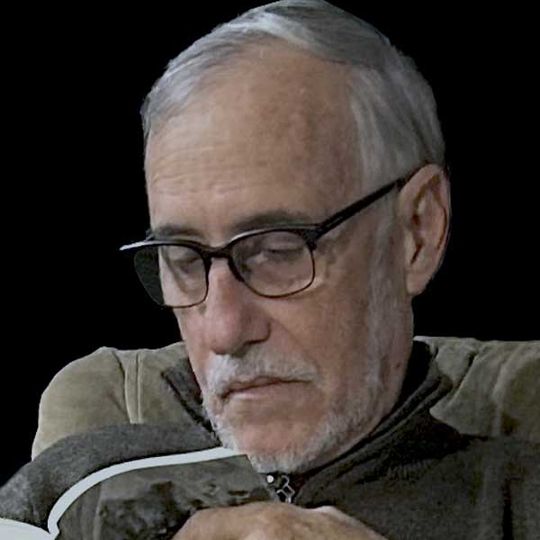 Jose Fernandez Pequeno reading a book.
